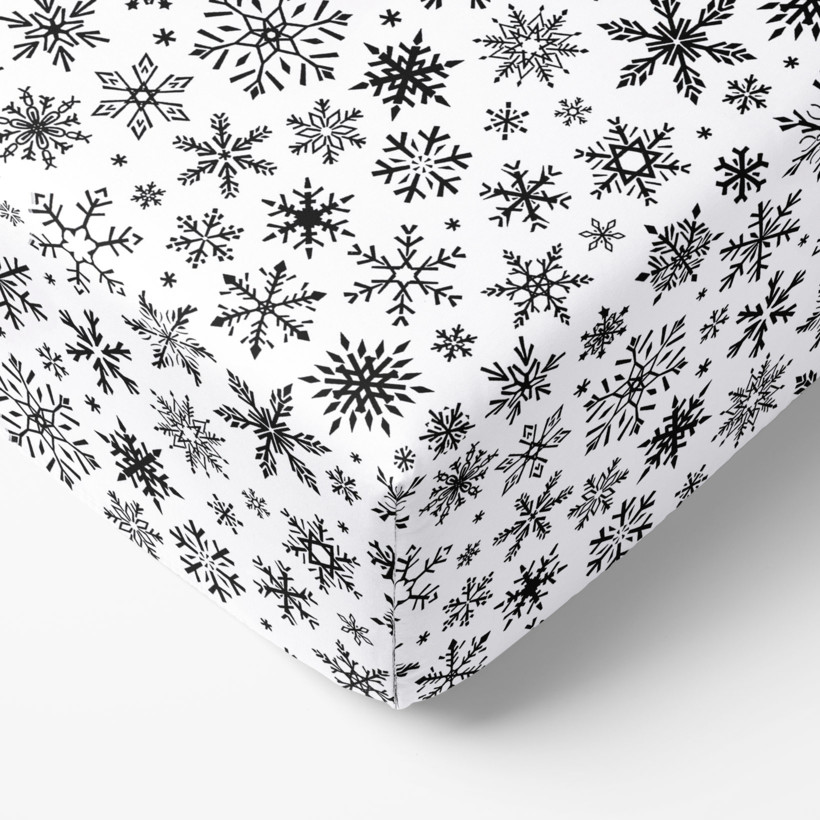 Karácsonyi körgumis pamut lepedő - cikkszám 1160 fekete hópihék fehér alapon