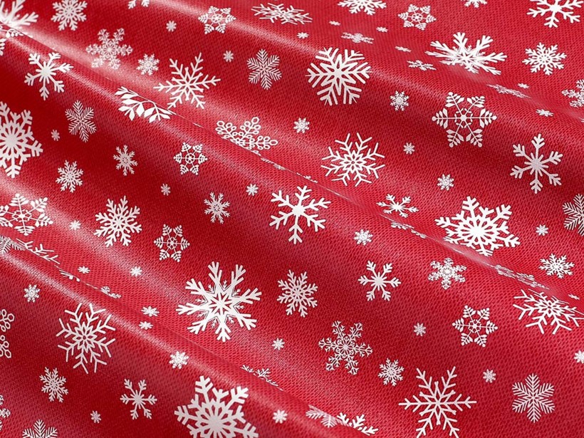 Textil hátoldalú pvc terítő - Karácsonyi mintás, hópihék piros alapon