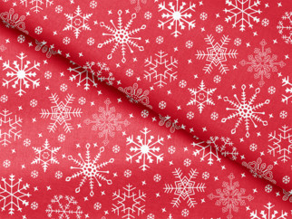 Bavlněná látka - vánoční vzor sněhové vločky na červeném - metráž š. 150cm