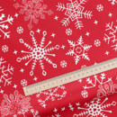 Pamutszövet - karácsonyi - hópihék piros alapon - méteráru, szél. 150 cm