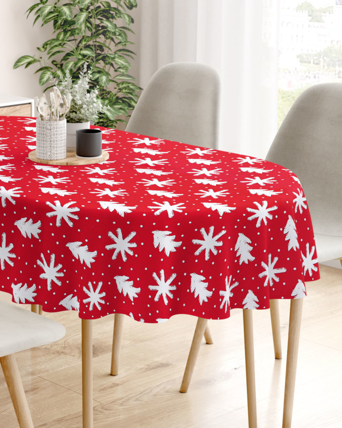 Karácsonyi pamut asztalterítő - hópihék és karácsonyfák piros alapon - ovális